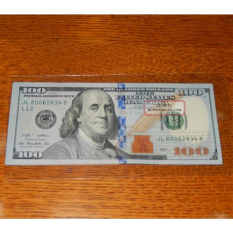 Low serial number bills up to 15,000 According to the experts, a redesigned 100 bill with the serial number 00000001 could fetch anywhere between 10,000 and 15,000. . 100 dollar bill serial number check
